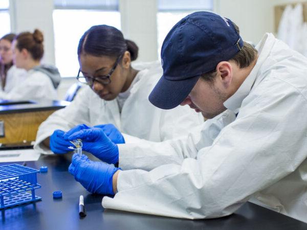 a couple of people in lab coats